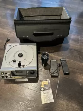A-62224 Kodak Slide Projector With Accessories Lens Remote And Case Turns On