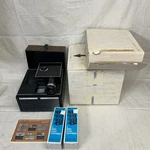 Bell & Howell 996Q Slide Cube Projector In Box Open. Price: $75.00.