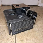 Vintage Bell & Howell Slide Cube Projector Auto Focus Partially Tested Used. Price: $79.99.