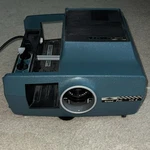 Sawyers Grand Prix 570 35MM Desktop Slide Projector Blue W/ Wired Remote Used. Price: $20.00.