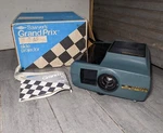 Mint Vintage Sawyer's Grand Prix 570-AF Slide Projector W/ Remote Box Used. Price: $135.00.