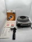 Kodak Ektagraphic AF-1 35MM Slide Projector Auto Focus W/case,manual,remote,etc Used. Price: $159.00.