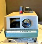 Vintage Cabimat Manon Automatic Slide Projector With Control And Cover Used. Price: $38.00.