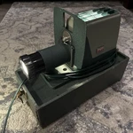 Vintage Argus 300 Automatic Slide Projector W/protective Case. Price: $29.95.