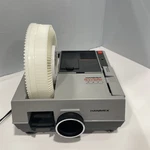 Hanimex Rondette 2000 35MM Slide Projector In Box With Lens & Cord Needs Bulb Used. Price: $41.00.