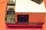 Leica Pradovit P2002 Slide Projector With Colorplan 90MM 1:2.5 Lens And Remote Used. Price: $650.00.