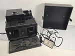 Vintage Bell & Howell Remote Slide Cube Projector Model 977Q Turns On - No Bulb. Price: $25.49.